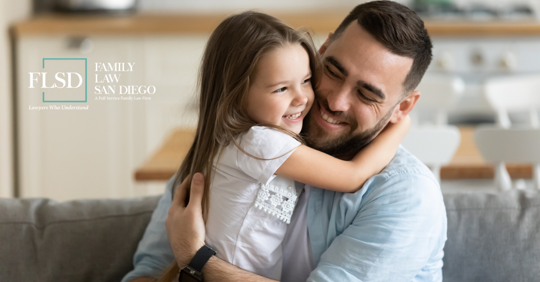 father holding daughter