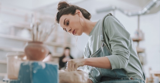 woman doing pottery