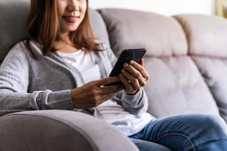 Woman using smartphone for co-parenting app