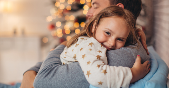 Father hugging daughter