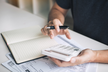 person budgeting with a calculator
