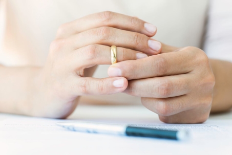 Woman looking at wedding ring on finger