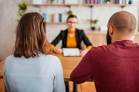 couple meeting with divorce attorney