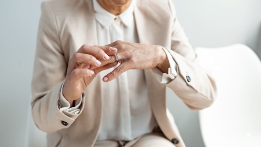 person taking ring off