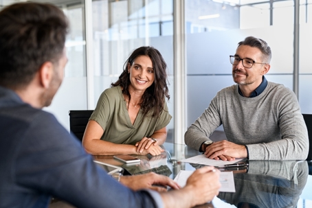 happy couple in front of a lawyer