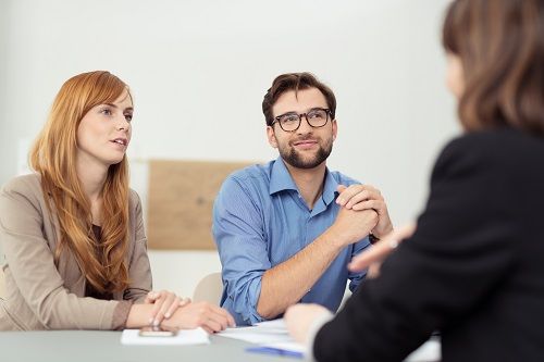 Man and woman speaking with a San Diego alternative dispute resolution lawyer.